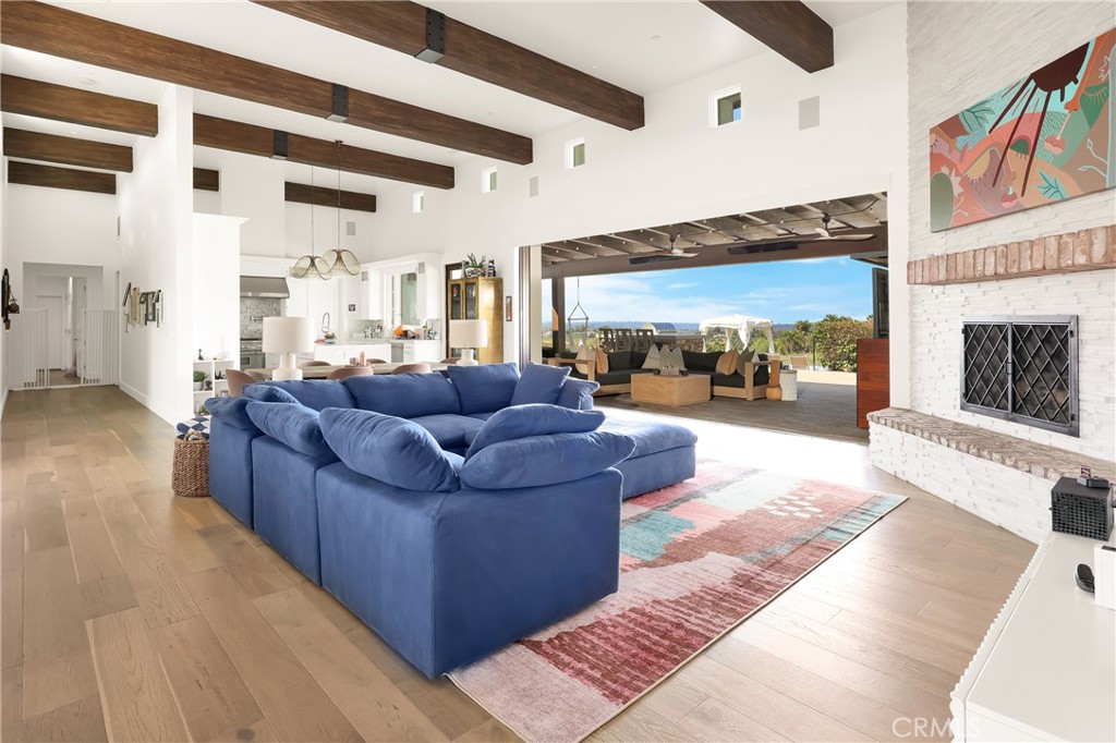 16582 Rio Vista Road San Diego, CA 92127 - Photo 8 of 49 a living room with furniture and a fireplace