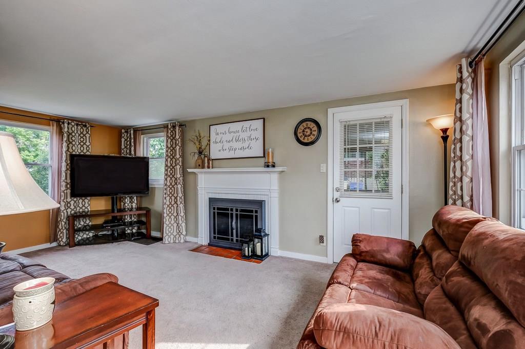 1912 Bower Hill Road Pittsburgh, PA 15243 - Photo 8 of 25 Family Room with Wood burning Fireplace and Door to the covered Side Patio