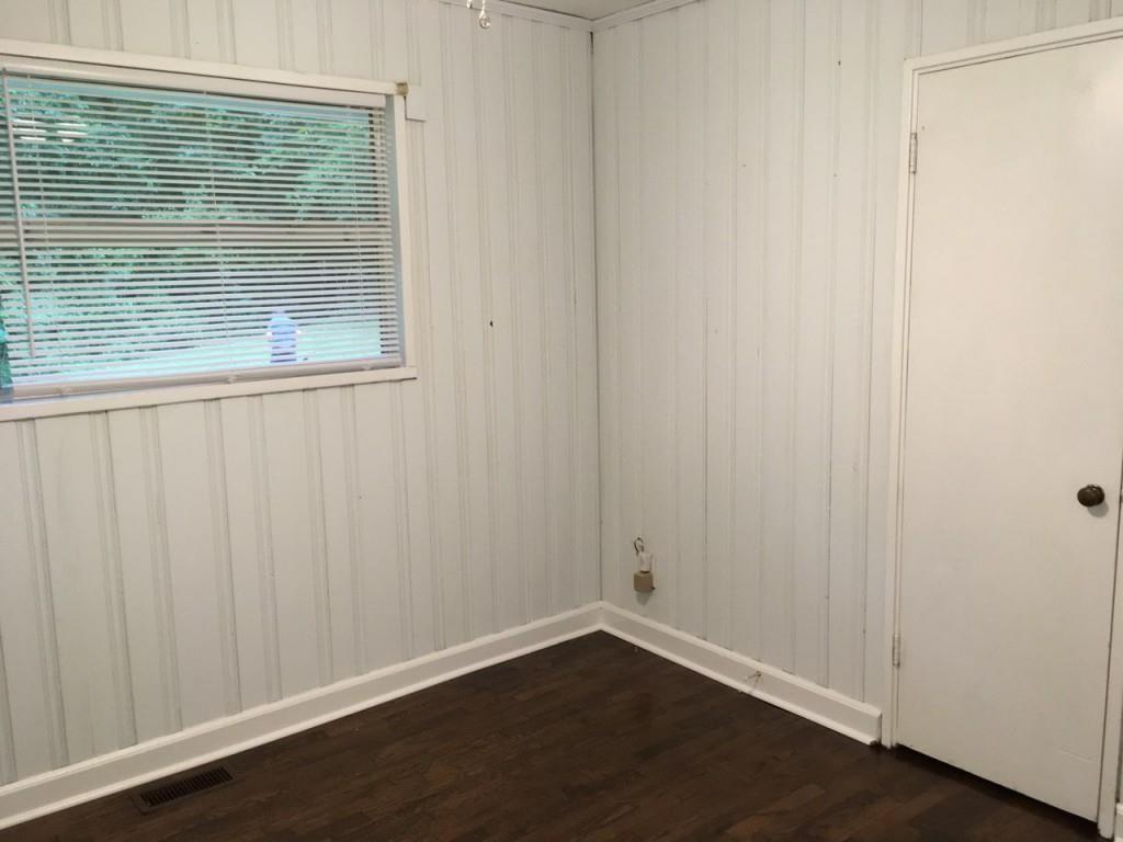 2335 Scotty Circle Decatur, GA 30032 - Photo 6 of 9 a view of an empty room with wooden floor and a window