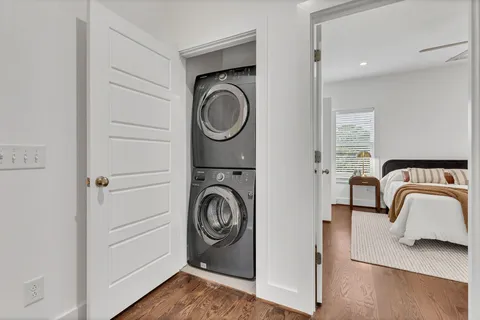 a utility room with sink dryer and washer
