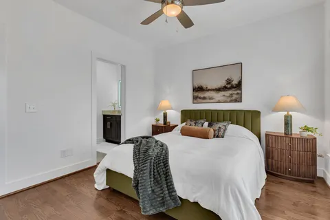 a bedroom with a bed and a lamp