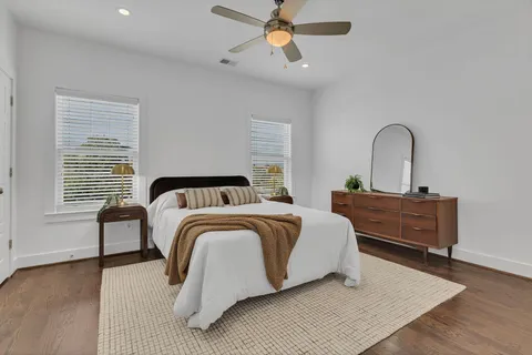 a bedroom with a bed and a dresser