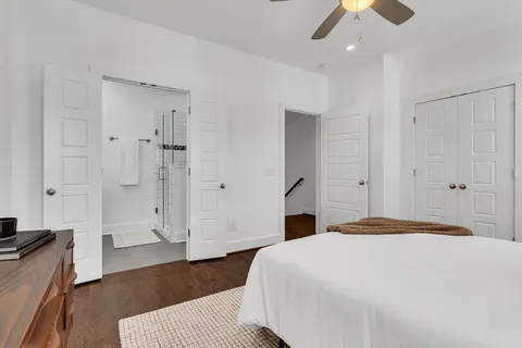 a bedroom with a bed and a couch