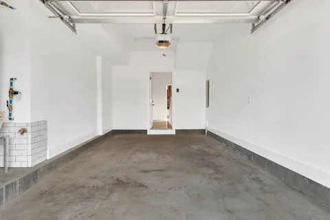 a view of empty room with ceiling fan