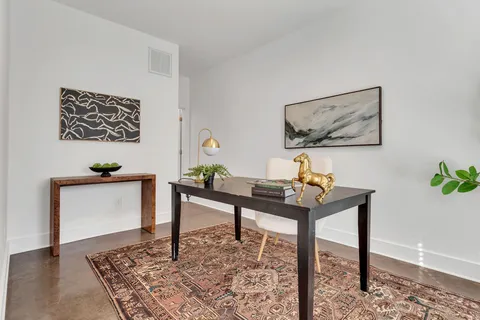 a view of a workspace with furniture