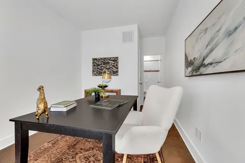 a view of a workspace with furniture