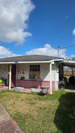 a front view of house with outdoor space and seating area