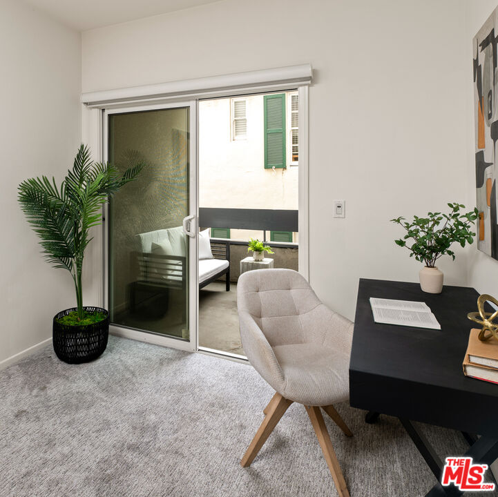 10627 Ashton Avenue, Unit 103 Los Angeles, CA 90024 - Photo 18 of 25 a living room with furniture potted plant and a window