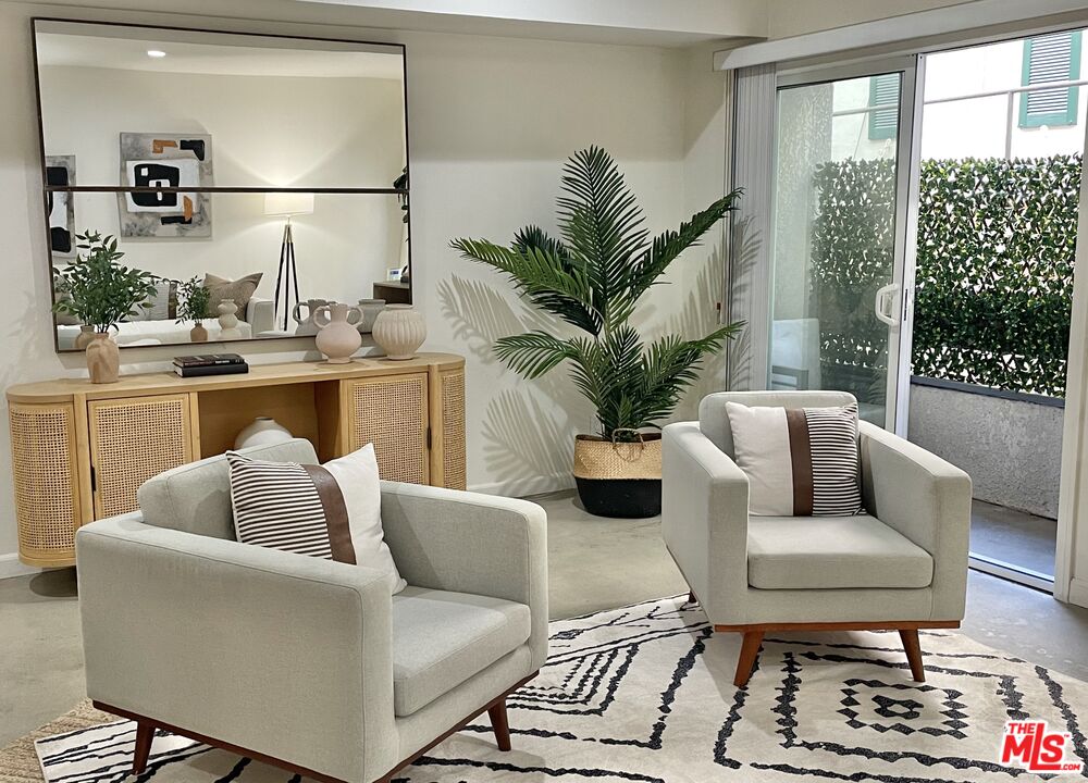 10627 Ashton Avenue, Unit 103 Los Angeles, CA 90024 - Photo 5 of 25 a living room with furniture and a potted plant