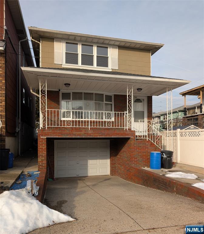 a front view of a house with parking