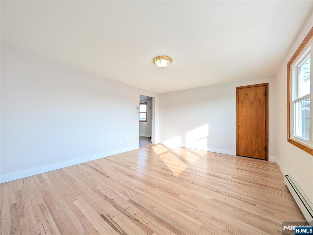 762 Cleveland Avenue, Unit 2 Harrison, NJ 07029 - Photo 3 of 14 a view of empty room with wooden floor and fan