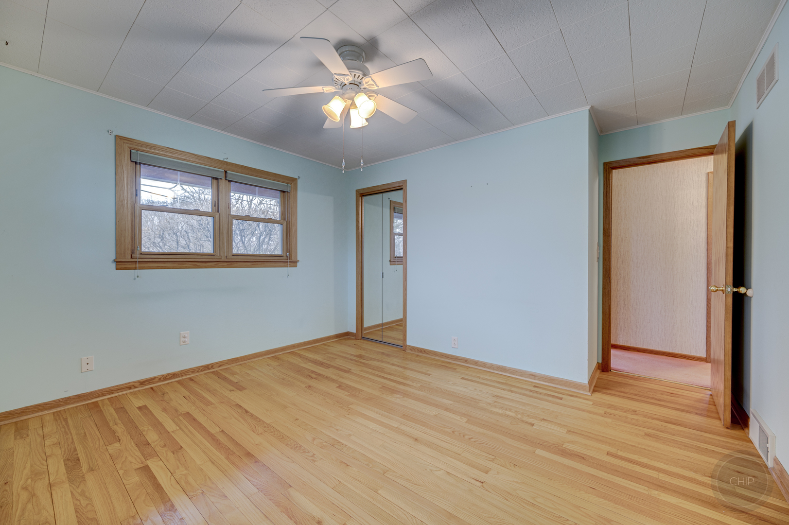 S528 Forest Street Winfield, IL 60190 - Photo 11 of 35 a view of an empty room with wooden floor and a window