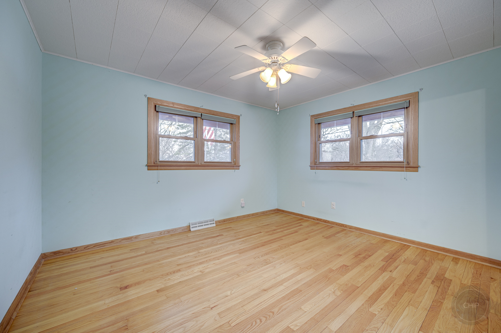 S528 Forest Street Winfield, IL 60190 - Photo 12 of 35 a view of an empty room with wooden floor and a window