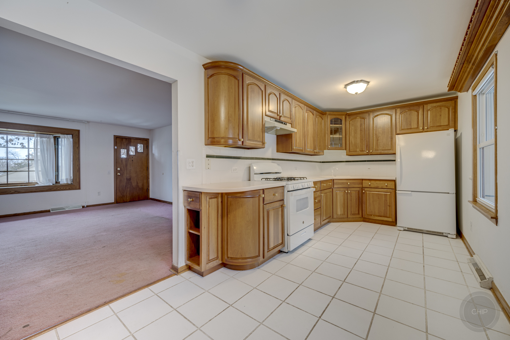 S528 Forest Street Winfield, IL 60190 - Photo 3 of 35 a kitchen with a refrigerator a stove top oven and cabinets
