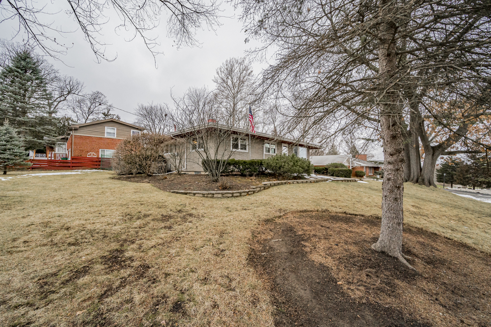 S528 Forest Street Winfield, IL 60190 - Photo 31 of 35 a front view of a house with a yard covered with snow and trees