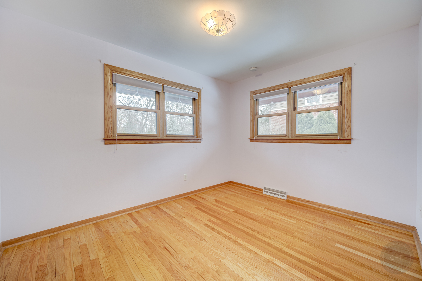 S528 Forest Street Winfield, IL 60190 - Photo 10 of 35 a view of an empty room with wooden floor and a window