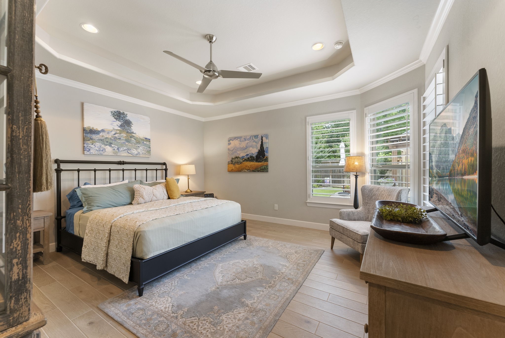 25607 Muirfield Bend Court Spring, TX 77389 - Photo 14 of 30 Private primary sanctuary featuring elevated ceiling details, expansive windows, and a peaceful sitting area designed for relaxation and quiet mornings.