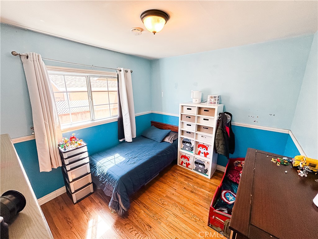 9362 Gullo Avenue Arleta, CA 91331 - Photo 14 of 29 a living room with furniture and a wooden floor