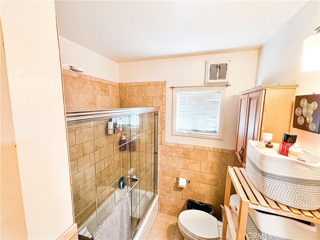 9362 Gullo Avenue Arleta, CA 91331 - Photo 15 of 29 a bathroom with a sink toilet tub and shower