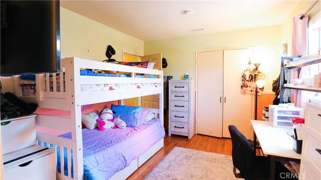 9362 Gullo Avenue Arleta, CA 91331 - Photo 18 of 29 a bedroom with a bed and a dresser