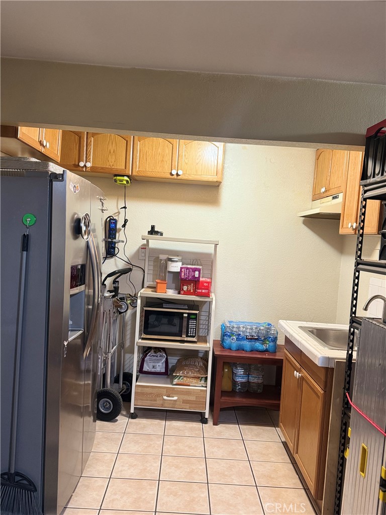 9362 Gullo Avenue Arleta, CA 91331 - Photo 26 of 29 a view of a room with shelves