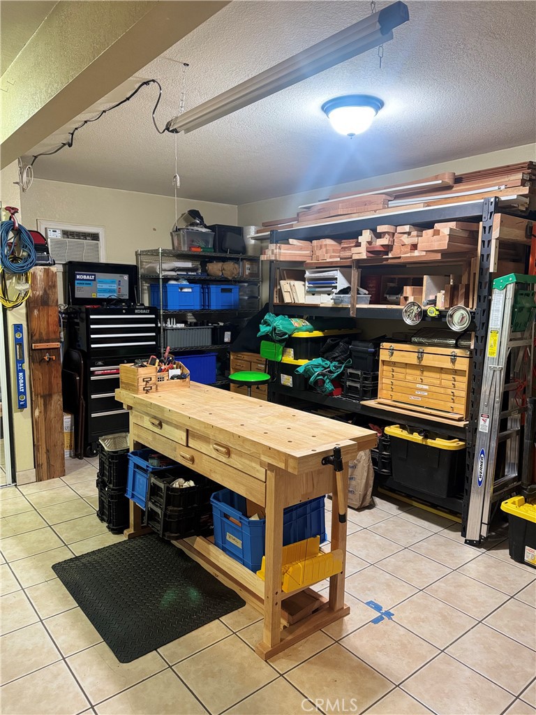 9362 Gullo Avenue Arleta, CA 91331 - Photo 28 of 29 a room with furniture and a flat screen tv