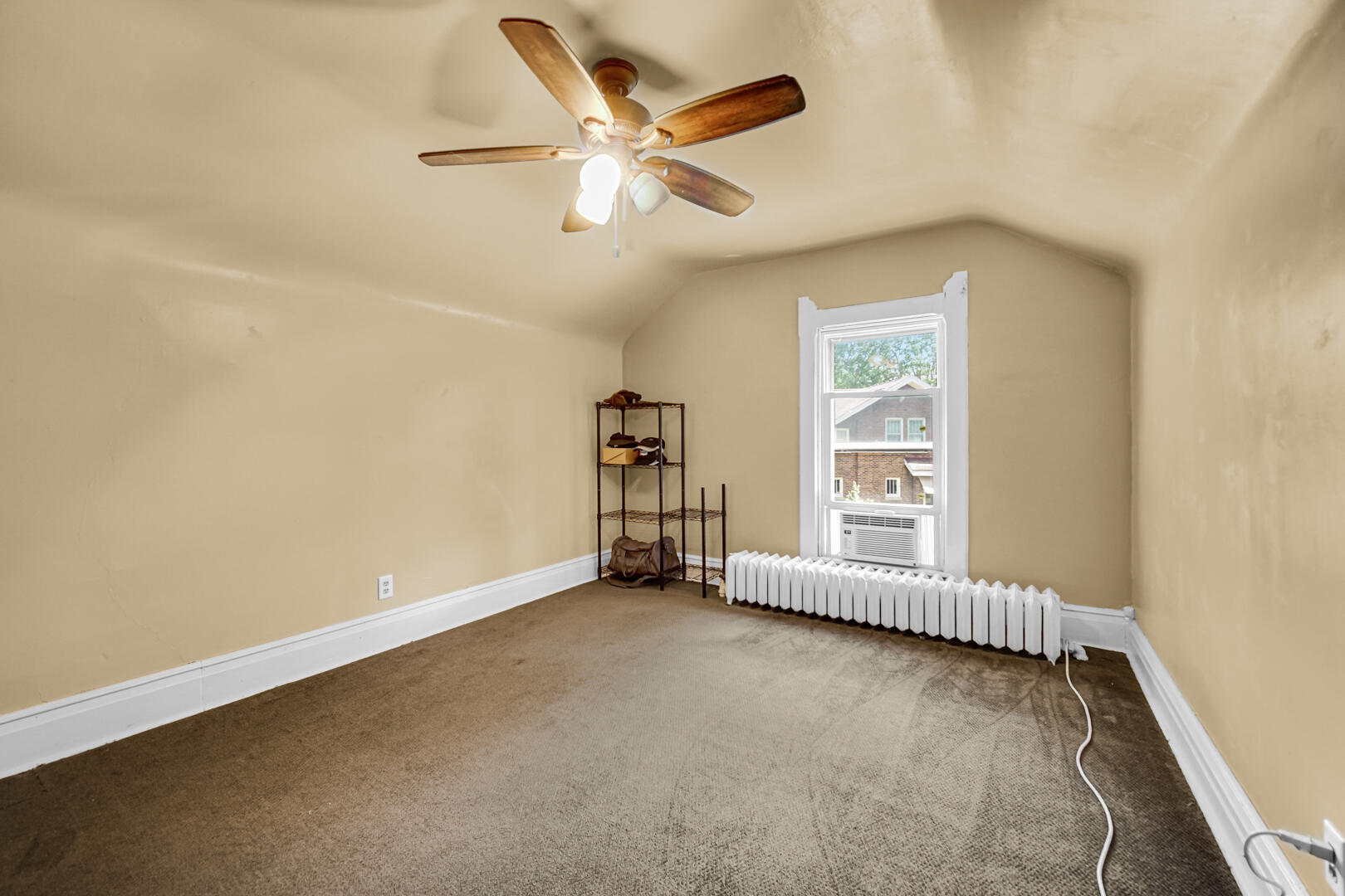 448 North Weston Street Rensselaer, IN 47978 - Photo 16 of 28 an empty room with chandelier fan and windows