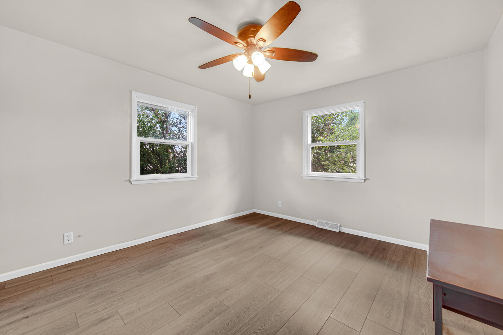 448 North Weston Street Rensselaer, IN 47978 - Photo 25 of 28 a view of an empty room with wooden floor and a ceiling fan