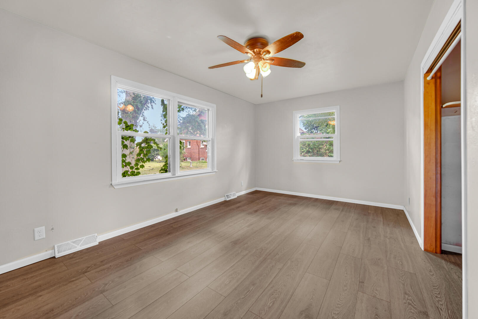 448 North Weston Street Rensselaer, IN 47978 - Photo 26 of 28 a view of an empty room with a window and wooden floor