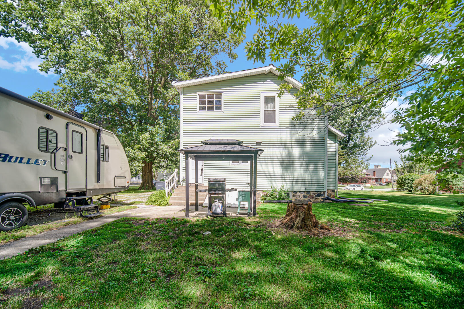 448 North Weston Street Rensselaer, IN 47978 - Photo 28 of 28 a view of backyard with house and outdoor seating
