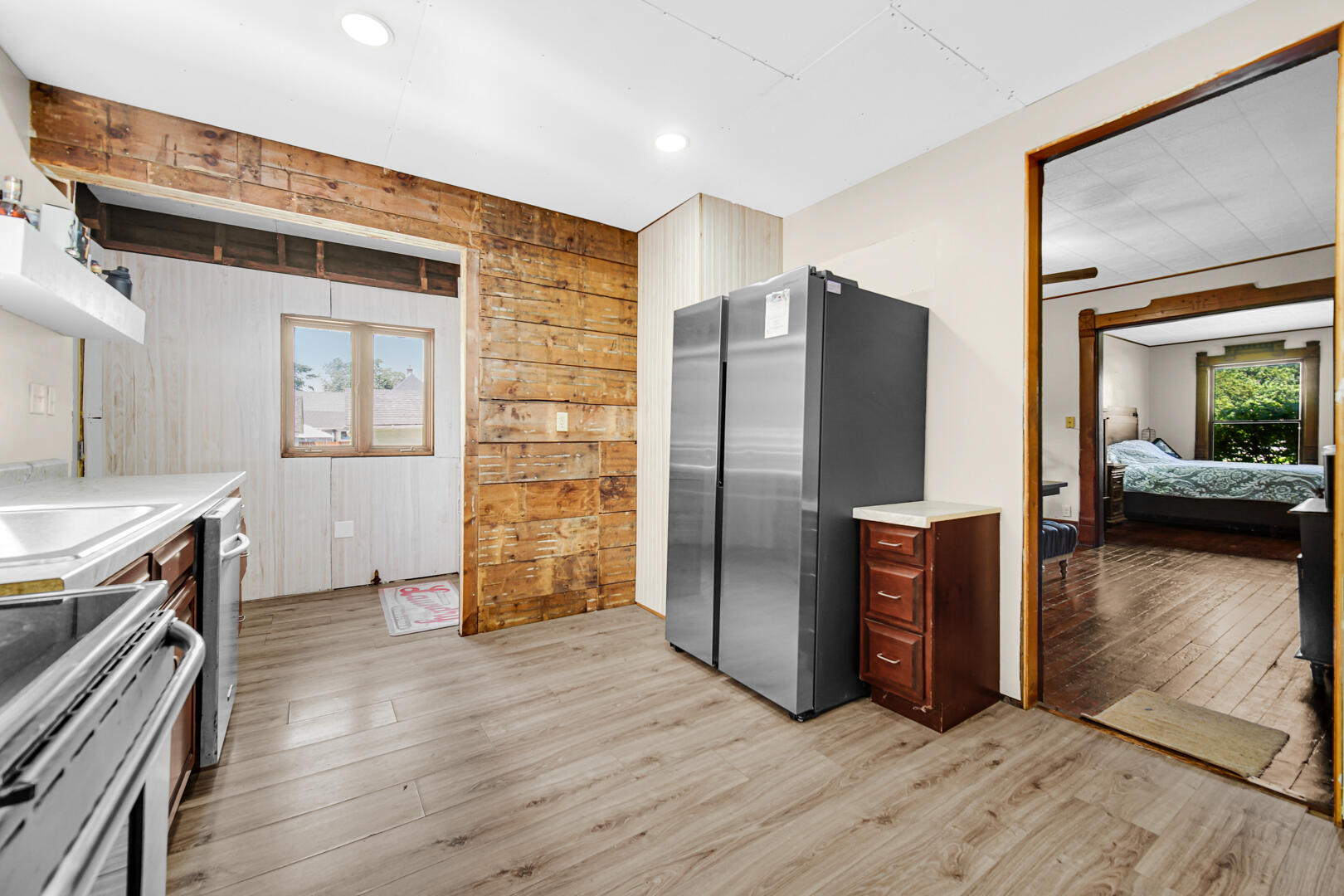 448 North Weston Street Rensselaer, IN 47978 - Photo 7 of 28 a kitchen with a refrigerator and a stove