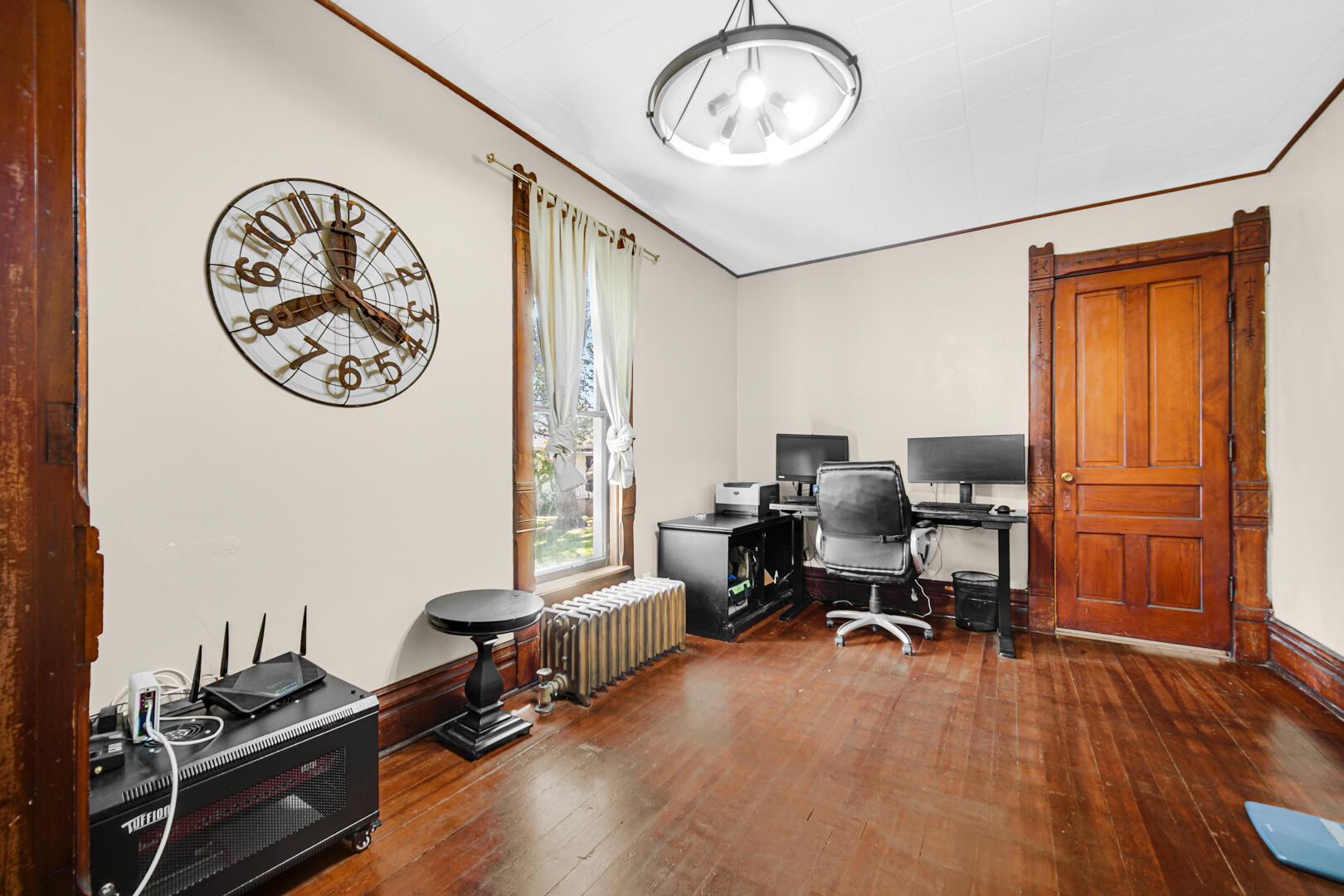 448 North Weston Street Rensselaer, IN 47978 - Photo 10 of 28 a view of a livingroom with workspace and a window