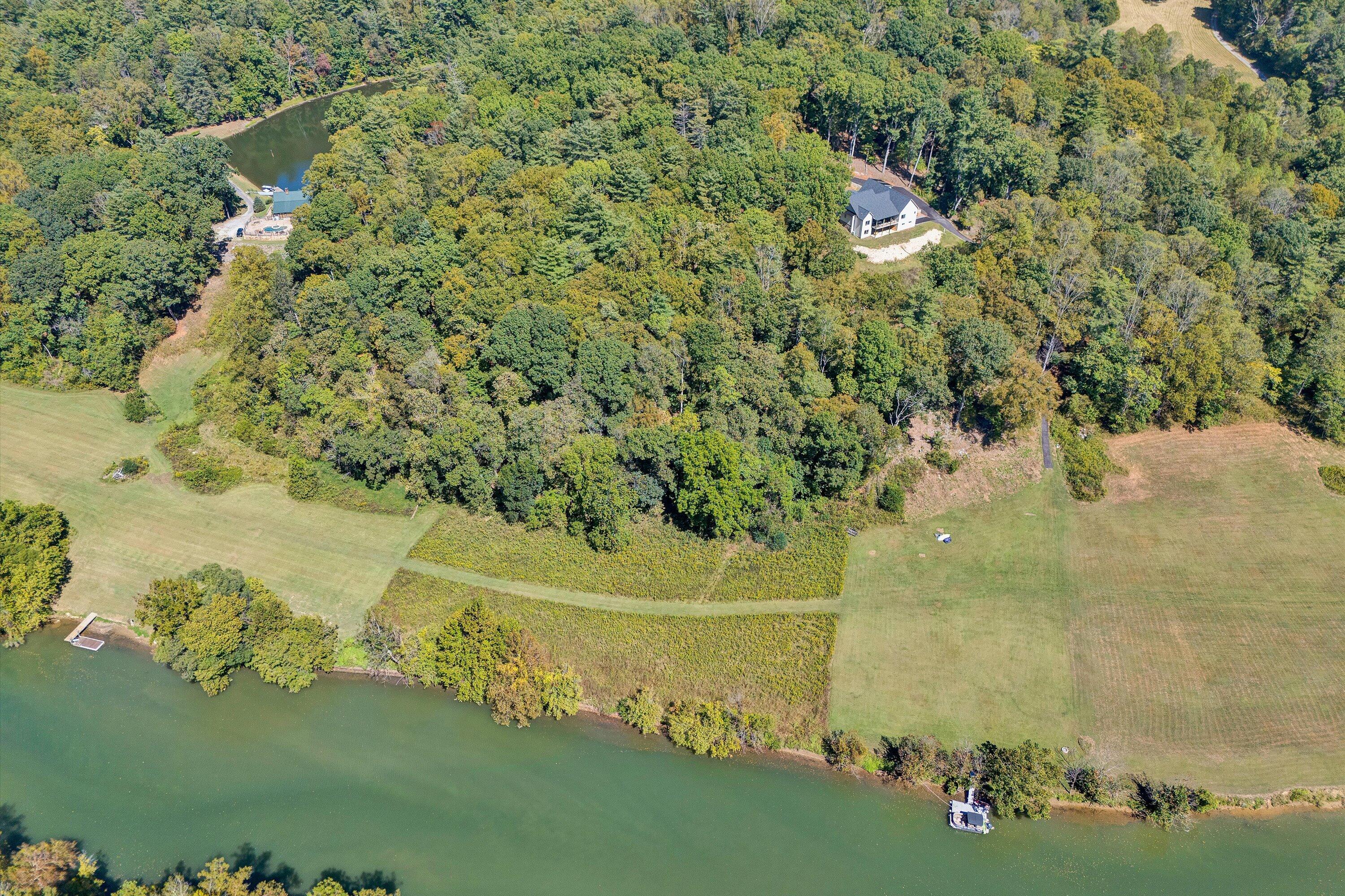 Lot 24 River Rock Road Vinton, VA 24179 - Photo 3 of 9 a view of a lake with a yard
