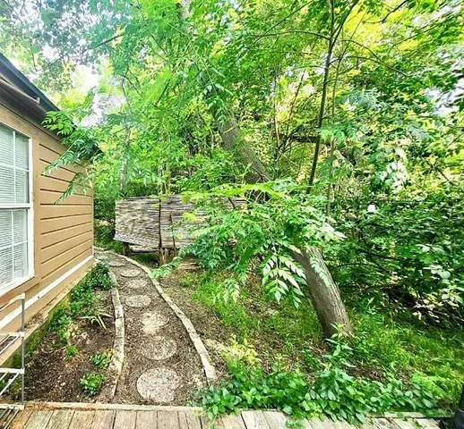 a backyard of a house with lots of green space