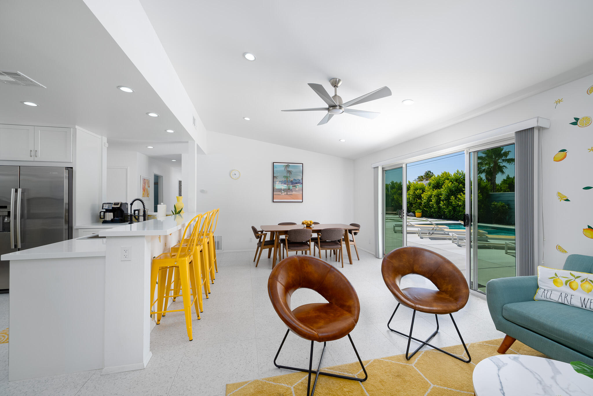 2383 East Powell Road Palm Springs, CA 92262 - Photo 11 of 32 a living room with furniture a rug and a floor to ceiling window