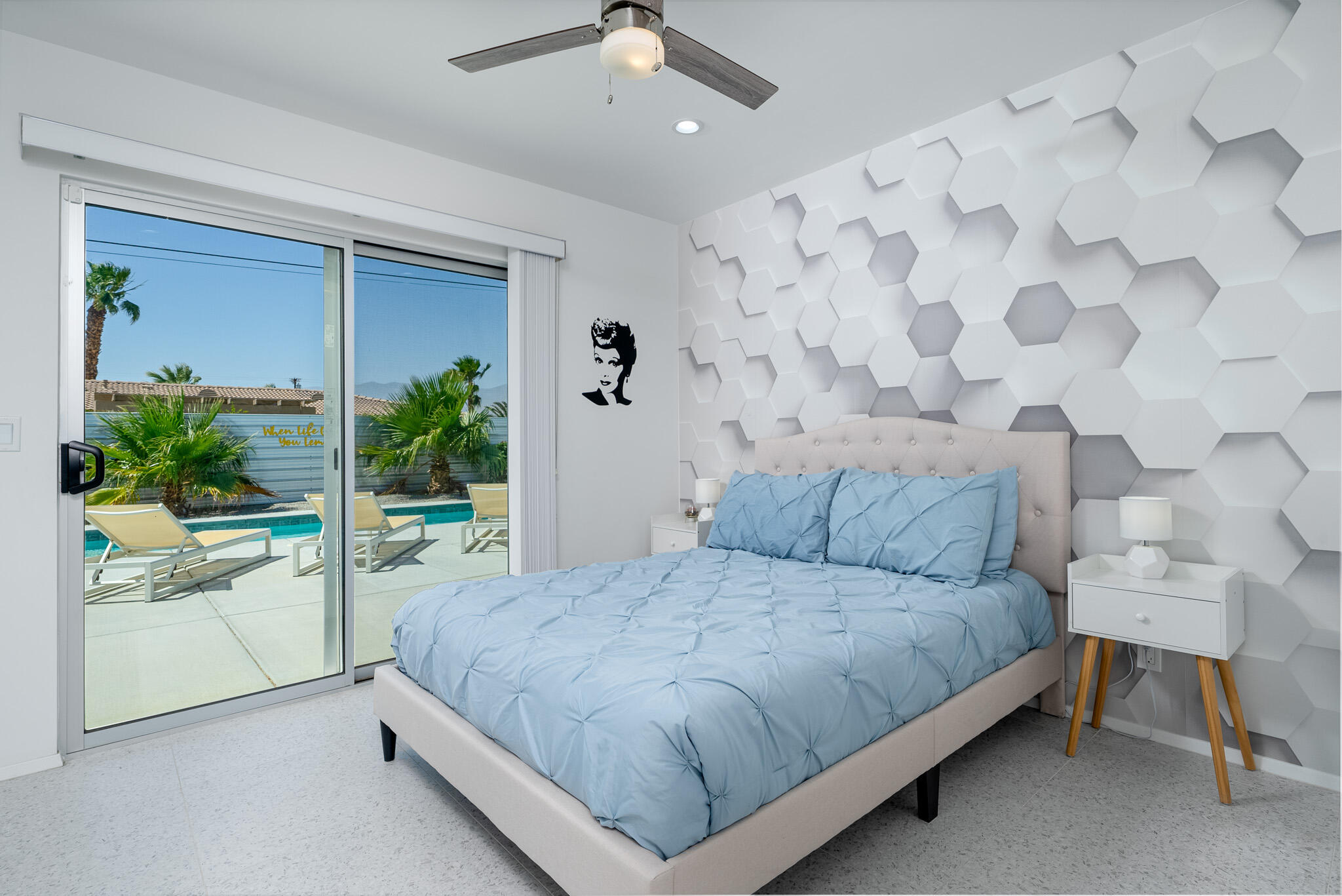 2383 East Powell Road Palm Springs, CA 92262 - Photo 23 of 32 a bedroom with a bed and a potted plant