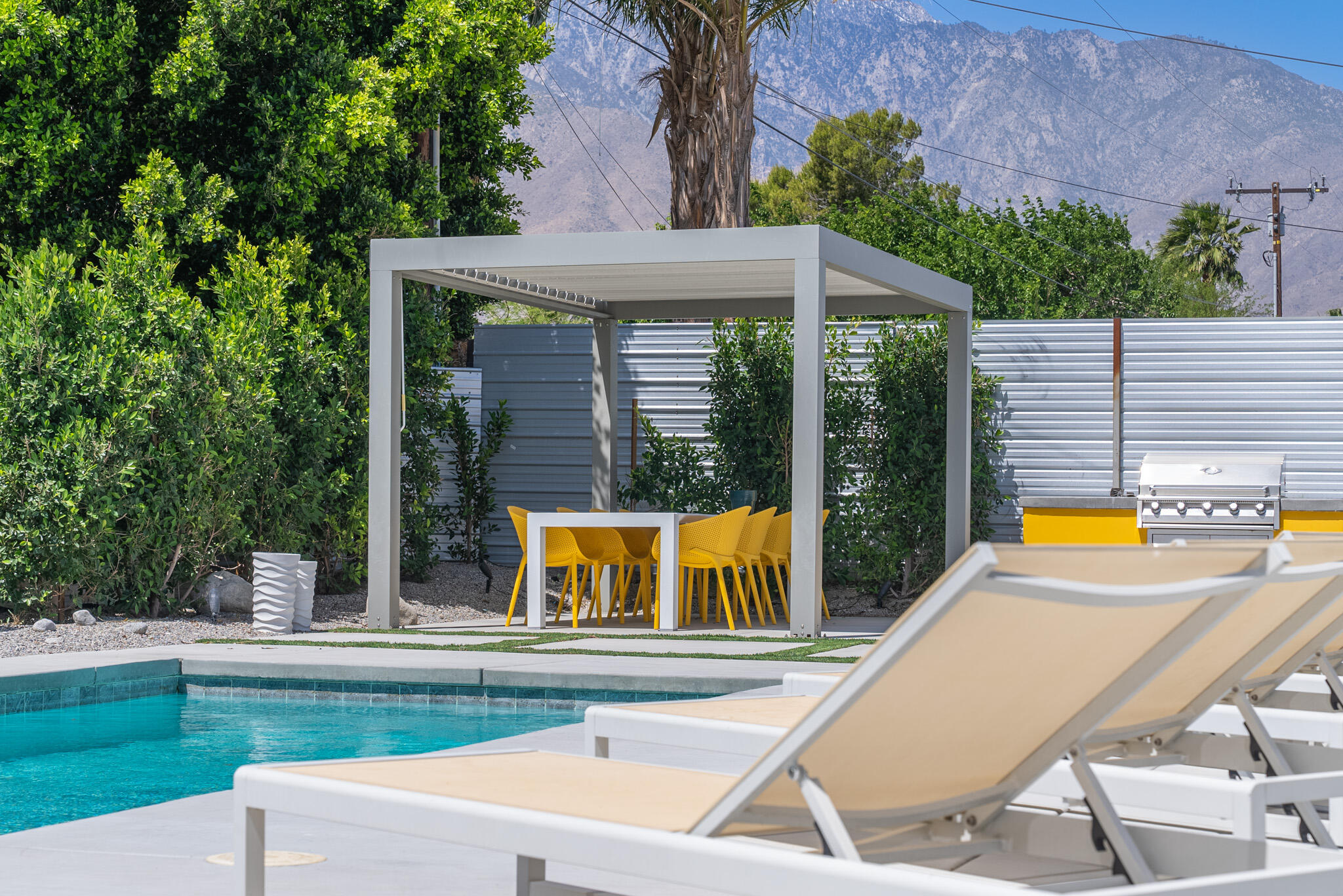 2383 East Powell Road Palm Springs, CA 92262 - Photo 29 of 32 a view of swimming pool with lawn chairs and plants