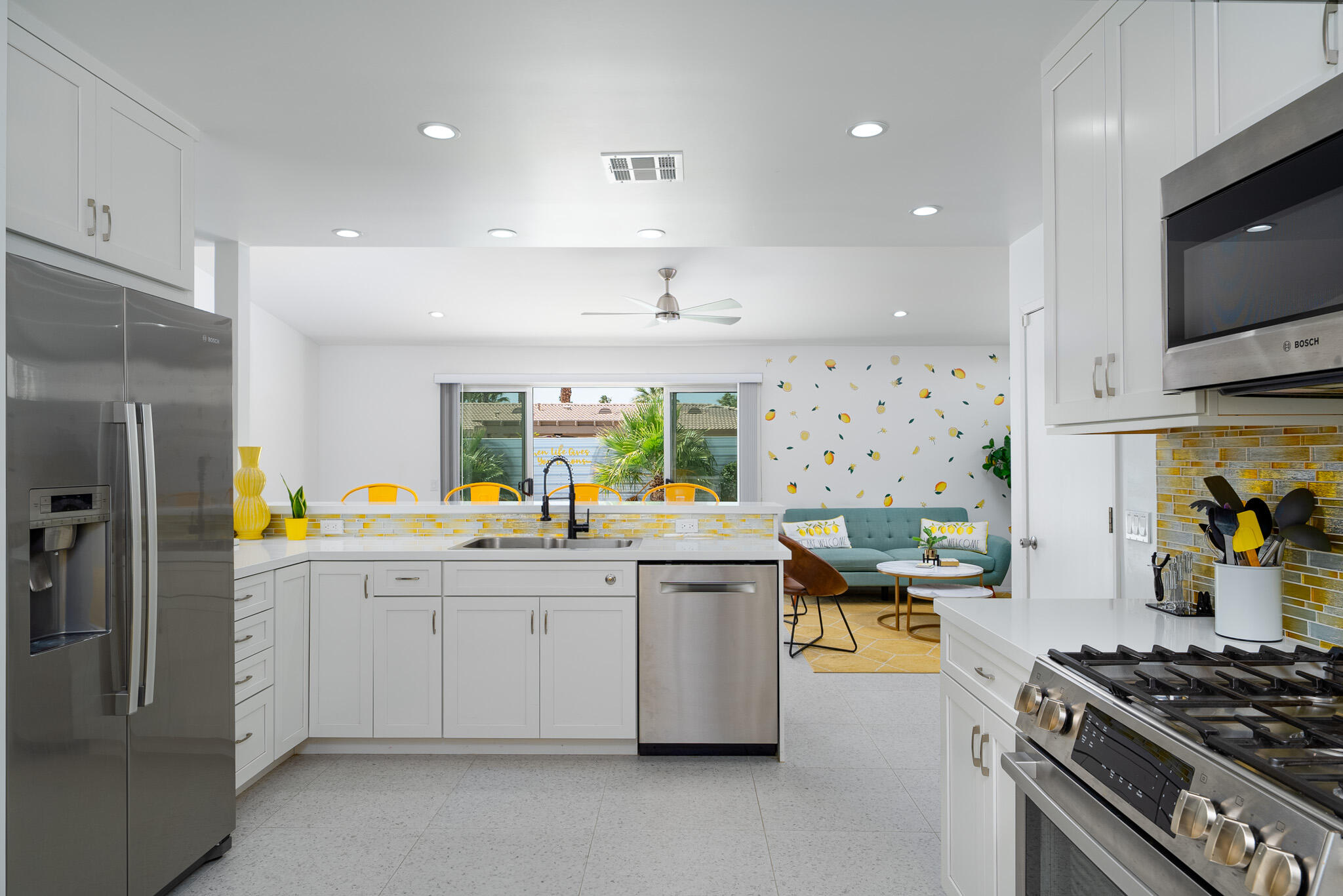 2383 East Powell Road Palm Springs, CA 92262 - Photo 4 of 32 a kitchen with stainless steel appliances a stove a sink and a refrigerator
