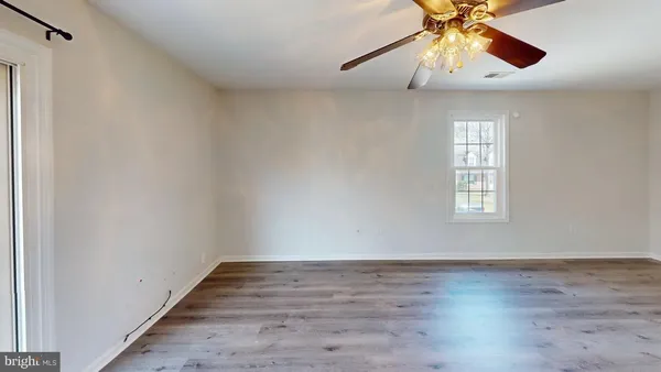 a bathroom with a toilet and a bath tub