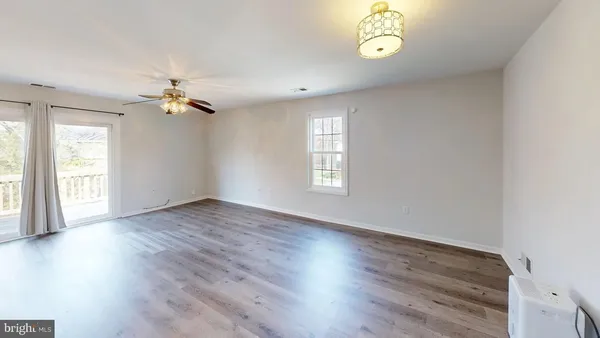 a view of a balcony with wooden floor and fence