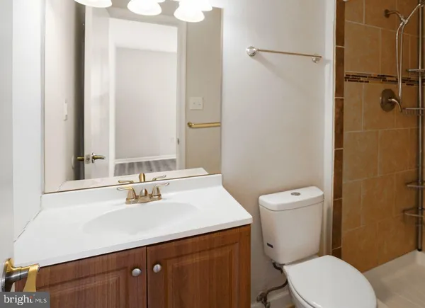 a kitchen with stainless steel appliances granite countertop a sink dishwasher a stove and a microwave oven with cabinets