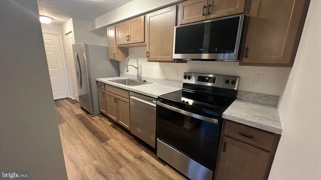 a kitchen with a stove and a microwave