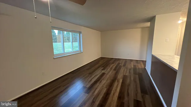 a view of wooden floor in an empty room