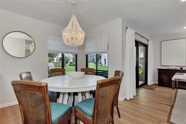 a kitchen with stainless steel appliances granite countertop a sink refrigerator and cabinets