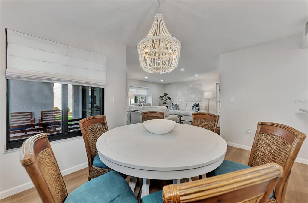 2950 North Beach Road, Unit A315 Englewood, FL 34223 - Photo 14 of 64 a view of a dining room with furniture