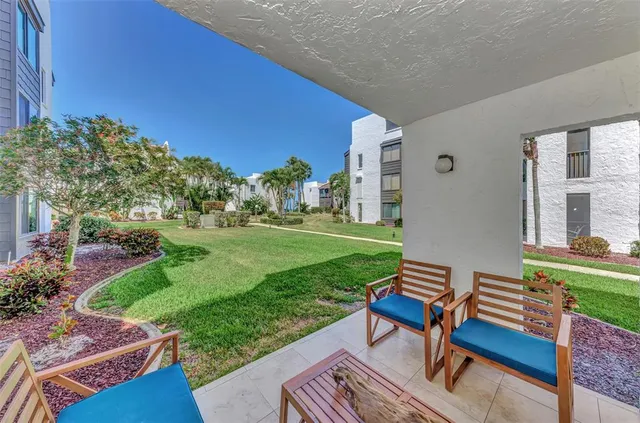 a house with a yard and palm trees