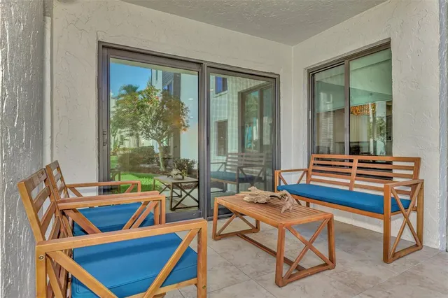 a dining room with furniture a flat screen tv and a rug
