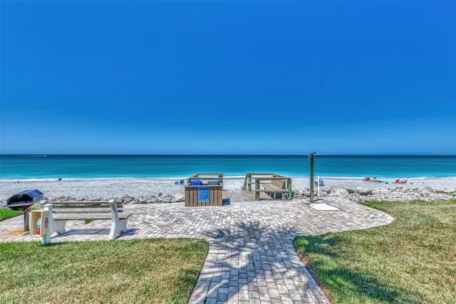a view of a patio with swimming pool and sitting area
