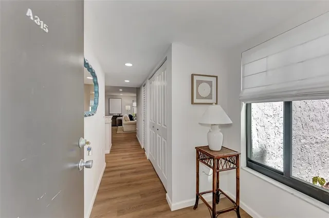 a open kitchen with stainless steel appliances granite countertop a stove and a refrigerator
