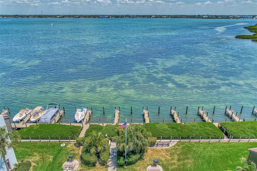 2950 North Beach Road, Unit A315 Englewood, FL 34223 - Photo 61 of 64 a view of a lake with a yard